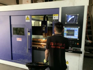 Operator controlling TRUMPF fiber laser cutter with IPG Photonics source for stainless steel fabrication – ZEMSS China