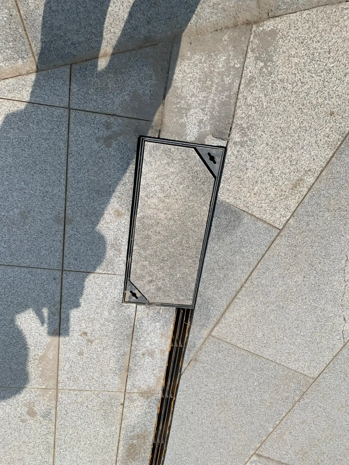 Stainless steel concealed manhole cover flush with stone paving – landscaping hardware by ZEMSS China