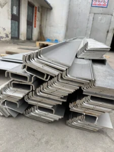Stacked stainless steel U-shaped bent sheet metal components – precision press brake fabrication by ZEMSS China