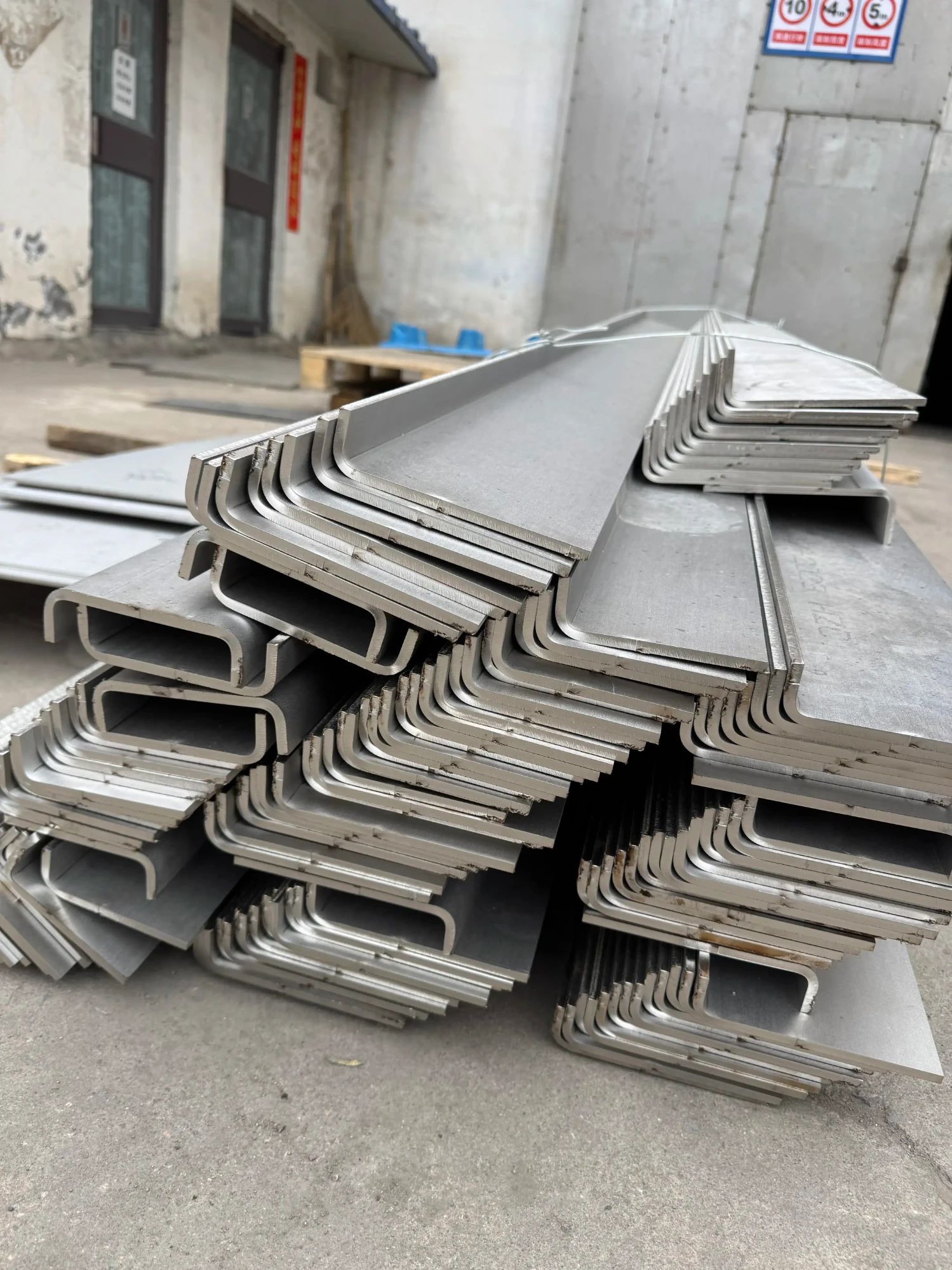 Stacked stainless steel U-shaped bent sheet metal components – precision press brake fabrication by ZEMSS China